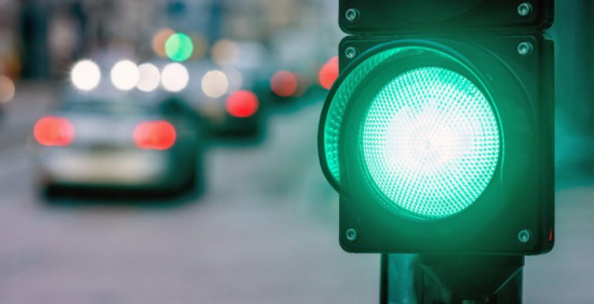 A city crossing with a semaphore. Green light in semaphore - image