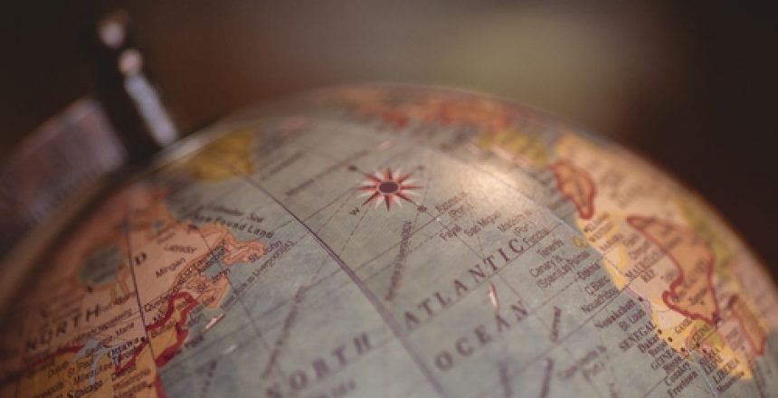 A closeup shot of a desk globe with a blurred background