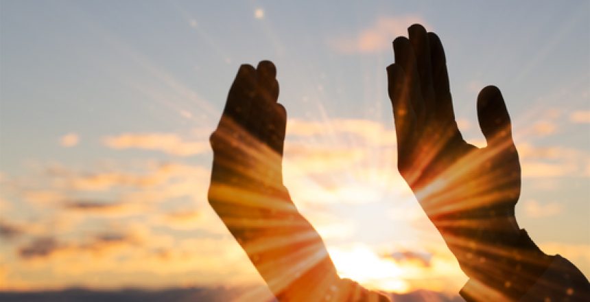 Silhouette of christian man hand praying,spirituality and religion,man praying to god. Christianity concept.